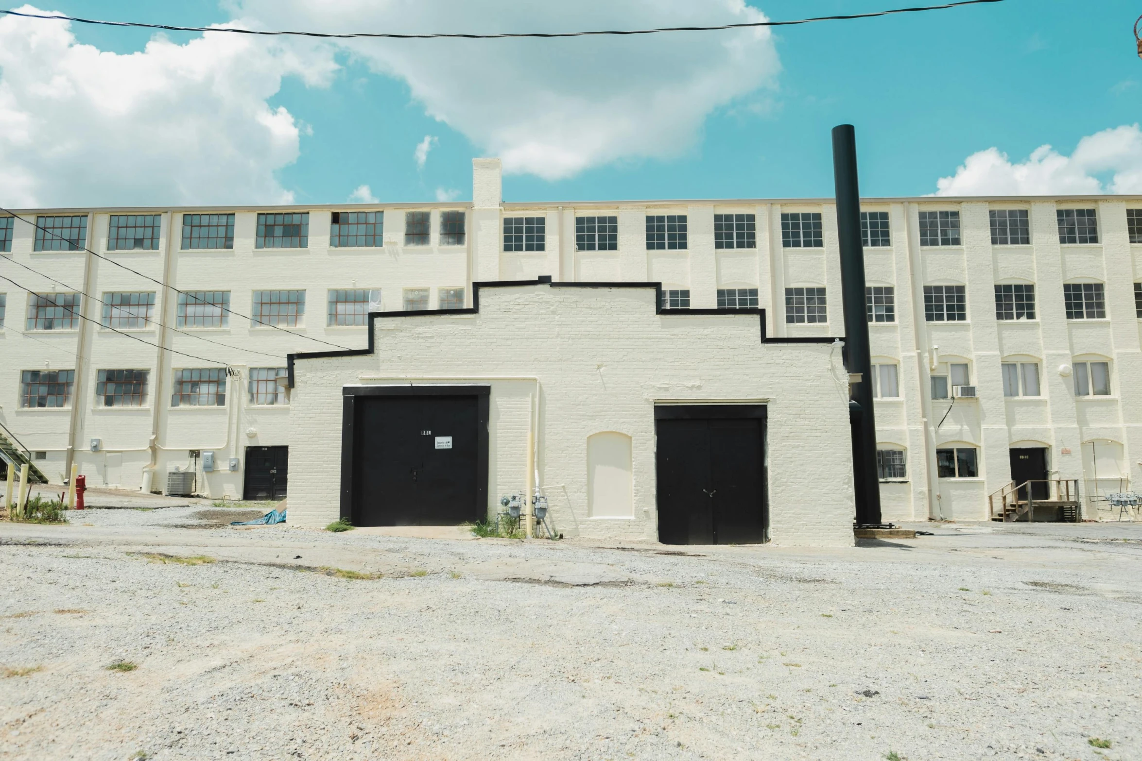 two large doors that are on the side of a building