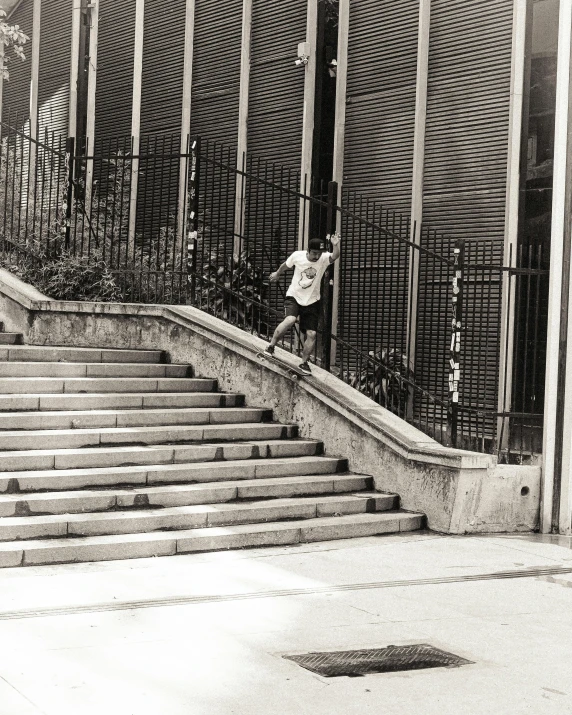 a person jumping a rail on top of a skateboard