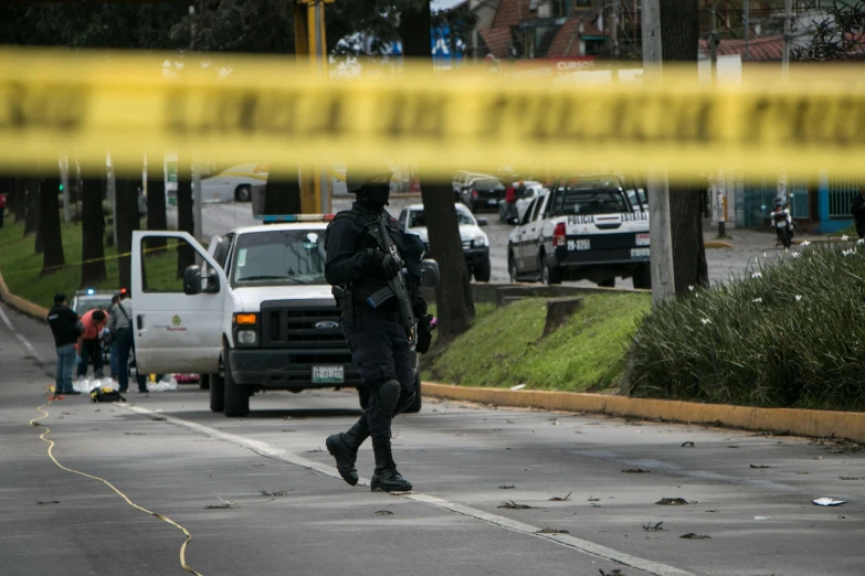 the man in the hat is being escorted away from the scene