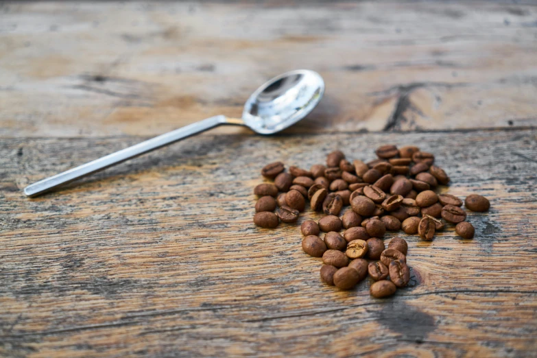 the coffee beans have been scattered on the table