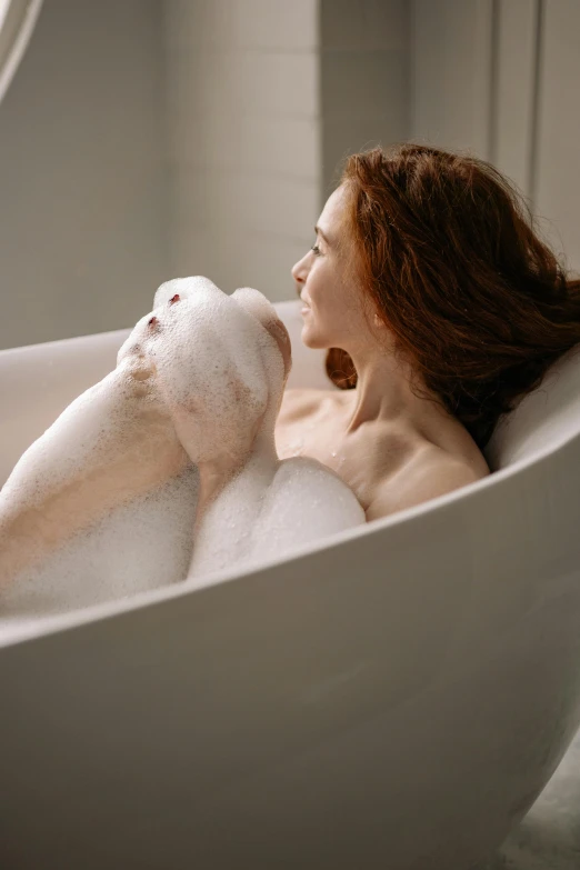 a woman relaxing in a bubble bath