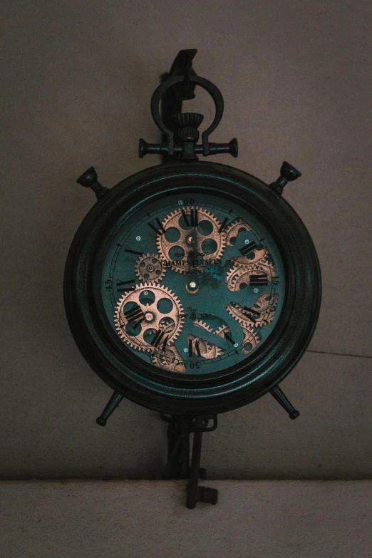 a clock made out of metal gears is on display