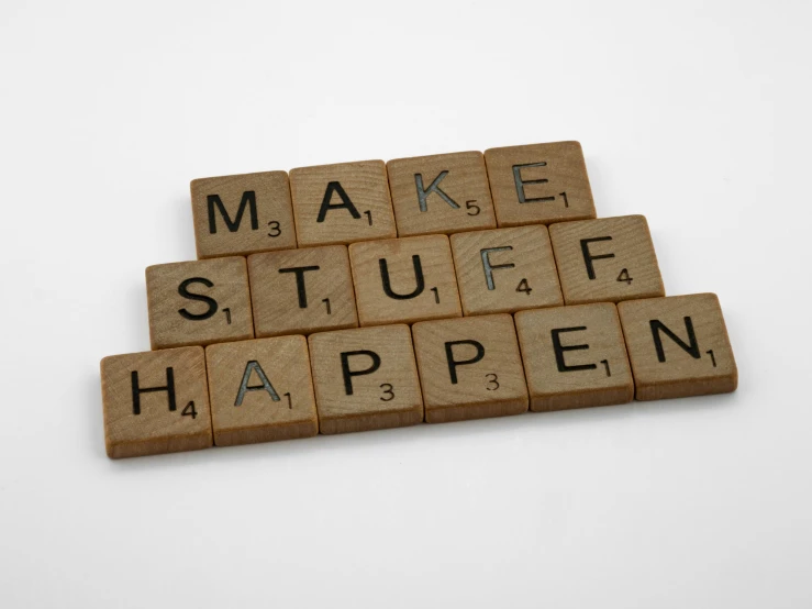 the word make stuff happen spelled in scrabble on top of each other