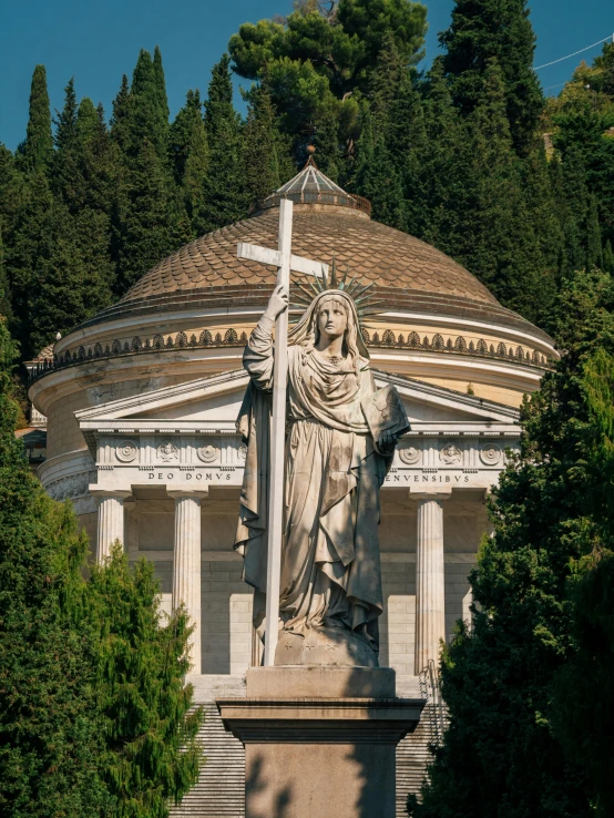 a statue stands in front of an ornate building