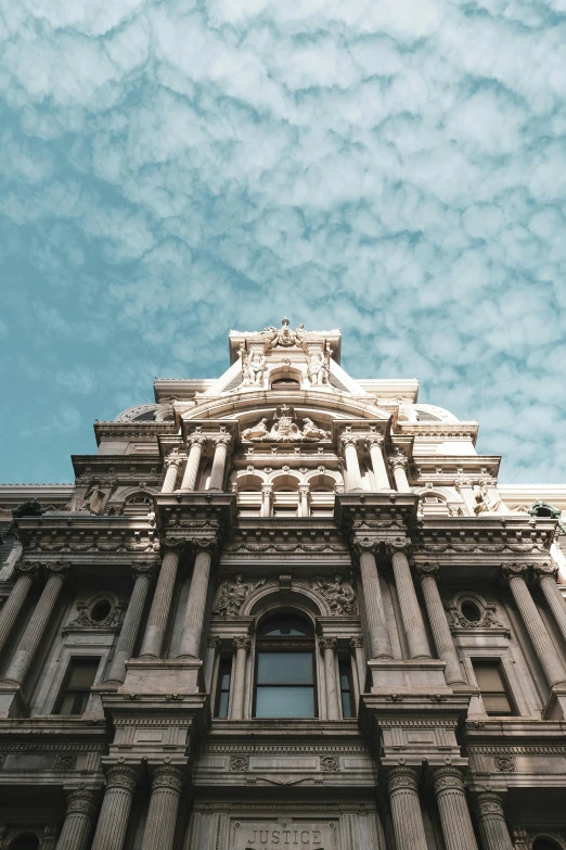 a large building has statues on it