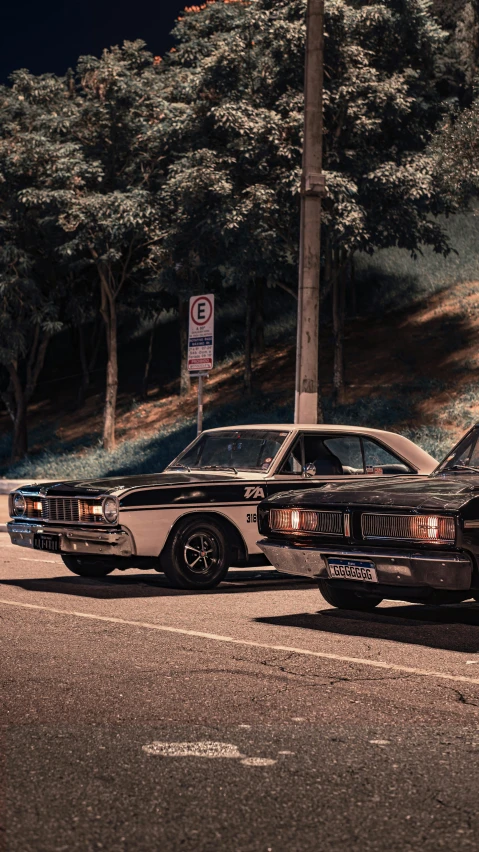 an older and new cars are parked next to each other