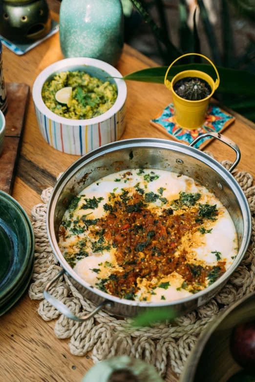 a dish is served on a doily on a wooden table