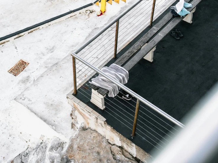 three people are walking up stairs to a roof