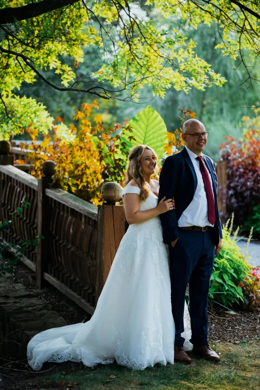 a couple getting ready to take a po in their wedding po