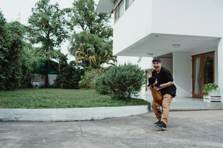 the man is running around in a parking lot with a ball