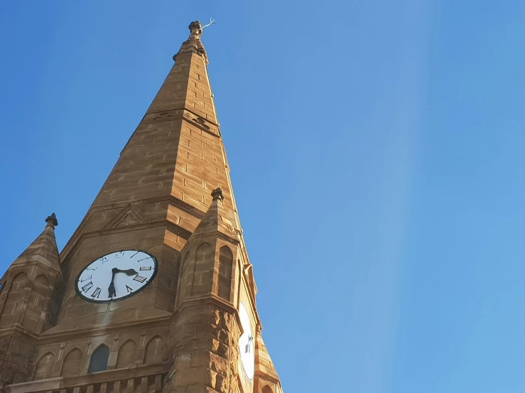 a church steeple with a clock built in it