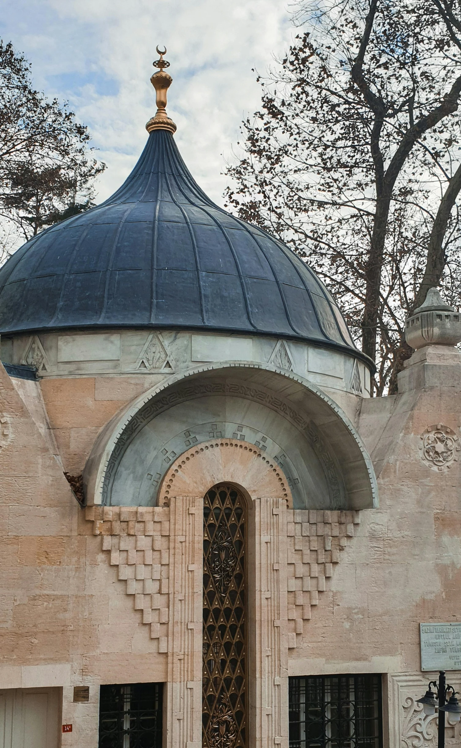 a large white church with a blue dome on top of it