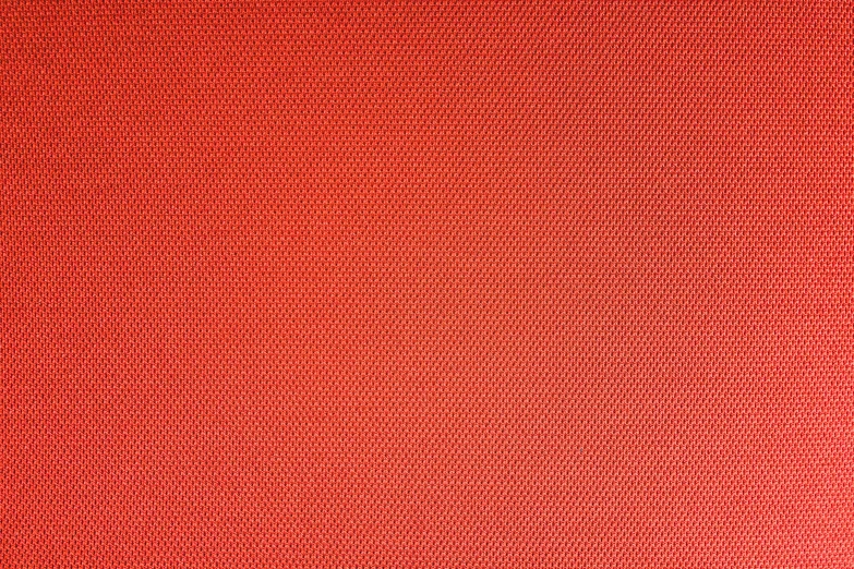 a red cloth with very large and small circles