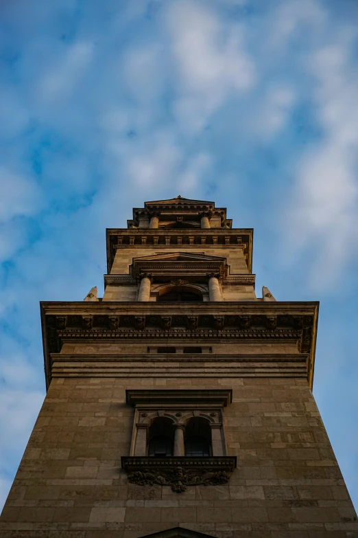 a clocktower with a sky in the background