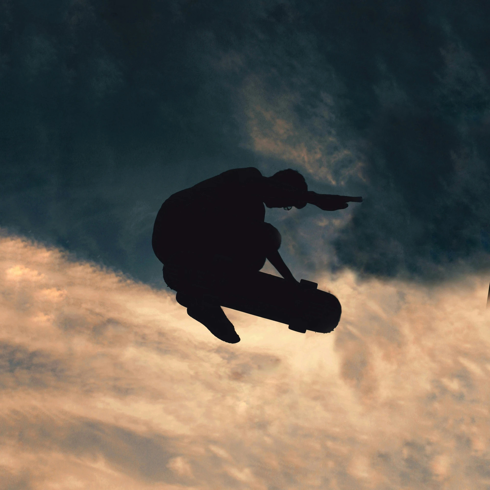 a man flying through the air while riding a skateboard