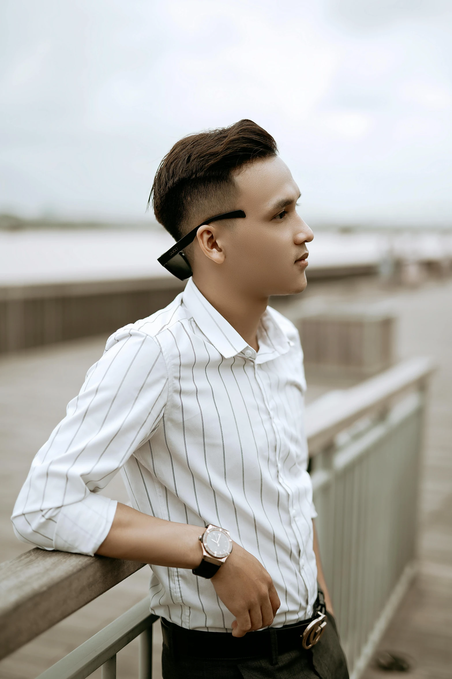 a man in a striped shirt and tie