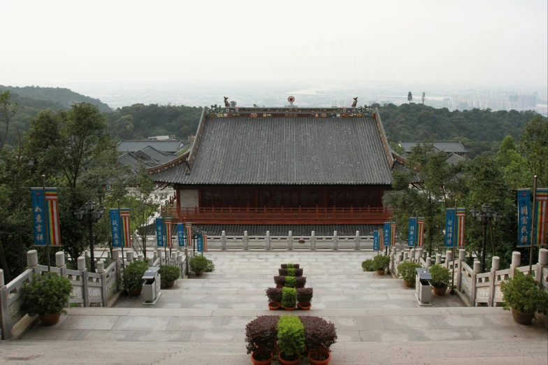 a building surrounded by plants and other decorations