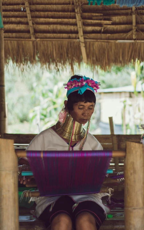 an asian woman dressed in traditional thai clothing