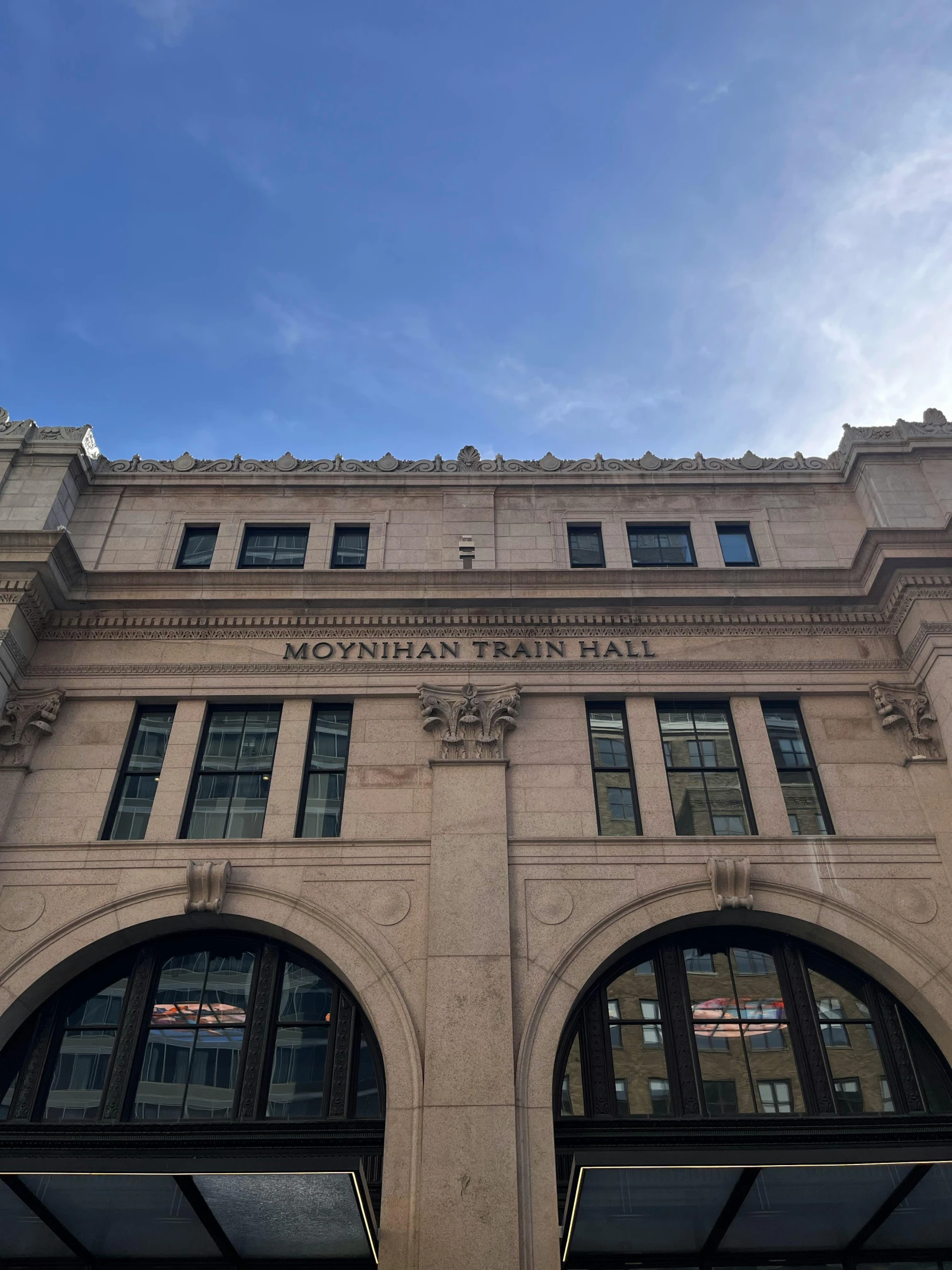 the facade of a building with two double doors