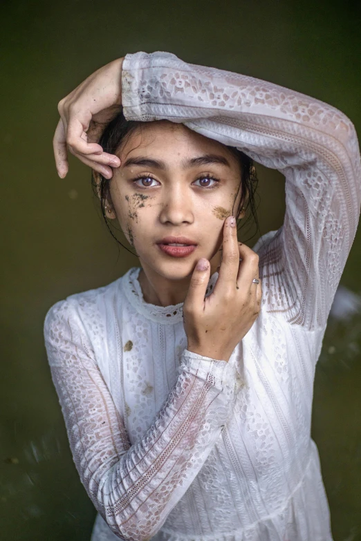 a woman with freckled hair posing for a picture