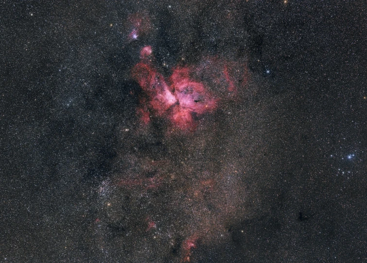 close up of a star formation in the distance with a few dust patterns