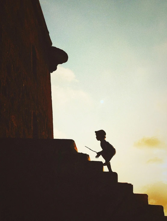 a man in a sun hat on some steps