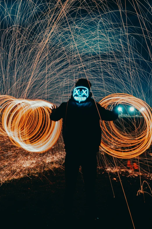 a person standing in front of some firework