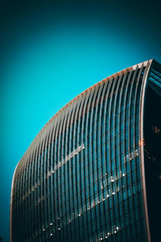 the building looks upward as it appears to have lines and curves on its walls