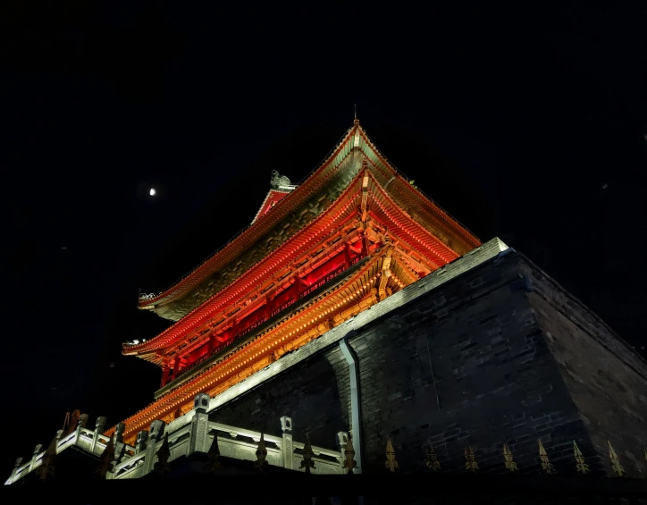 a tall tower with several stories lit up