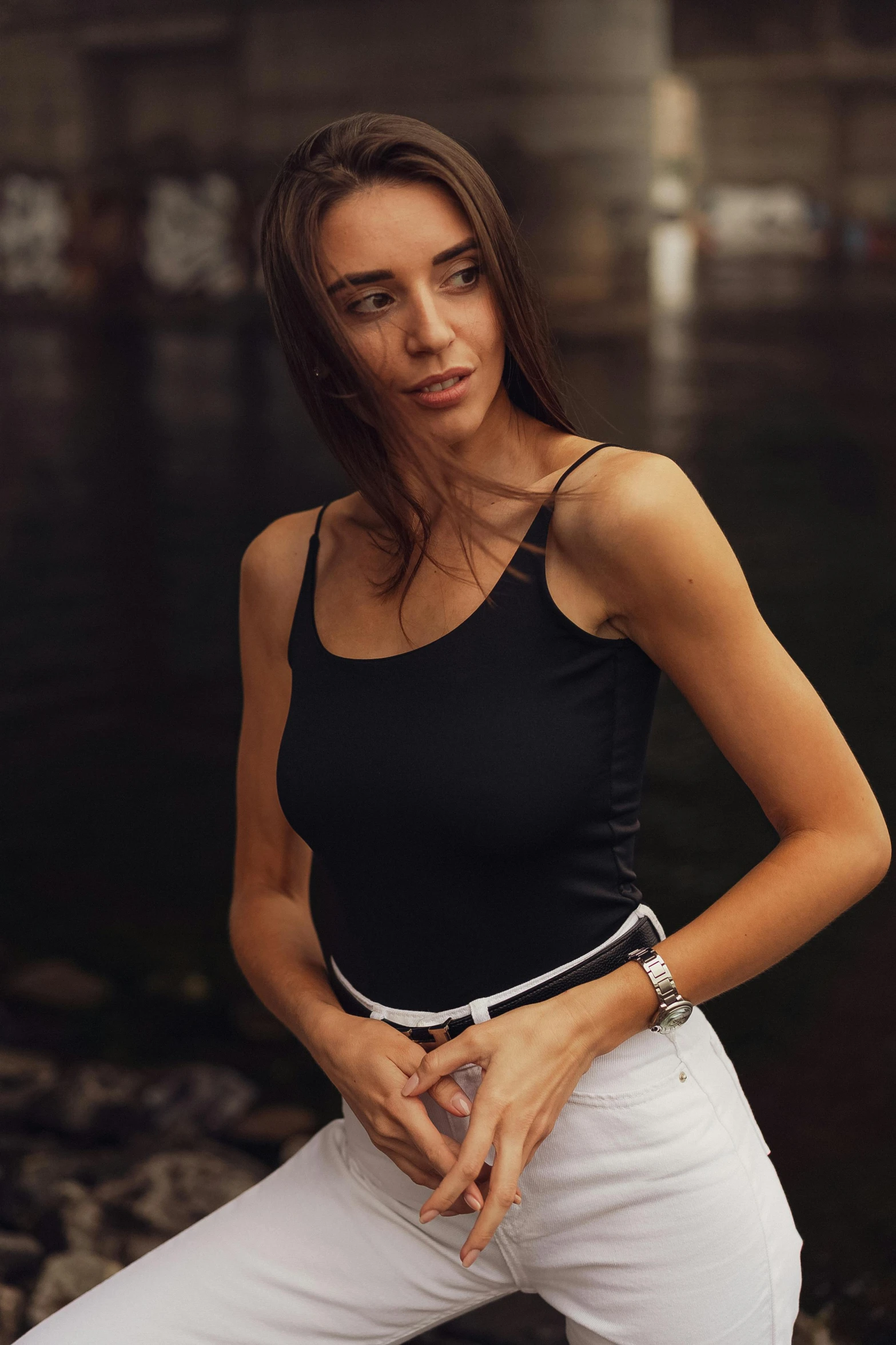 a woman posing for a picture in the rain