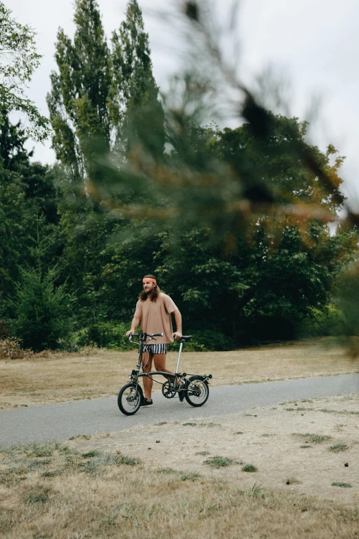 a man riding a bike down the road