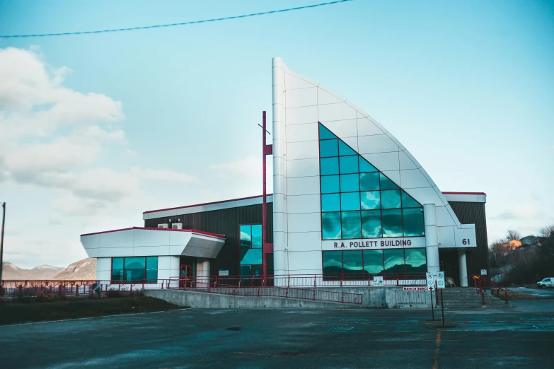 a building with a large triangle shaped windows