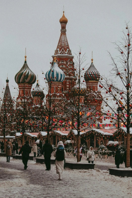 the tall building has many spires around it