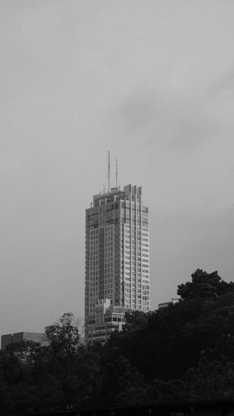 some tall buildings with some sky in the background