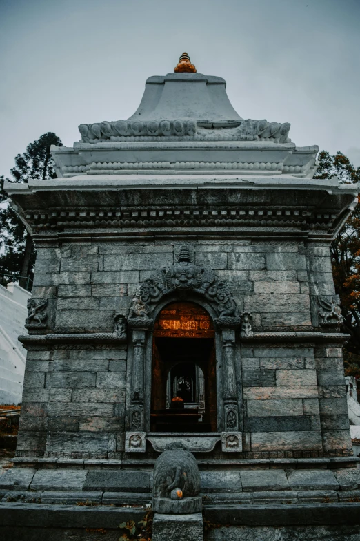 a black and grey image of an entrance to a temple
