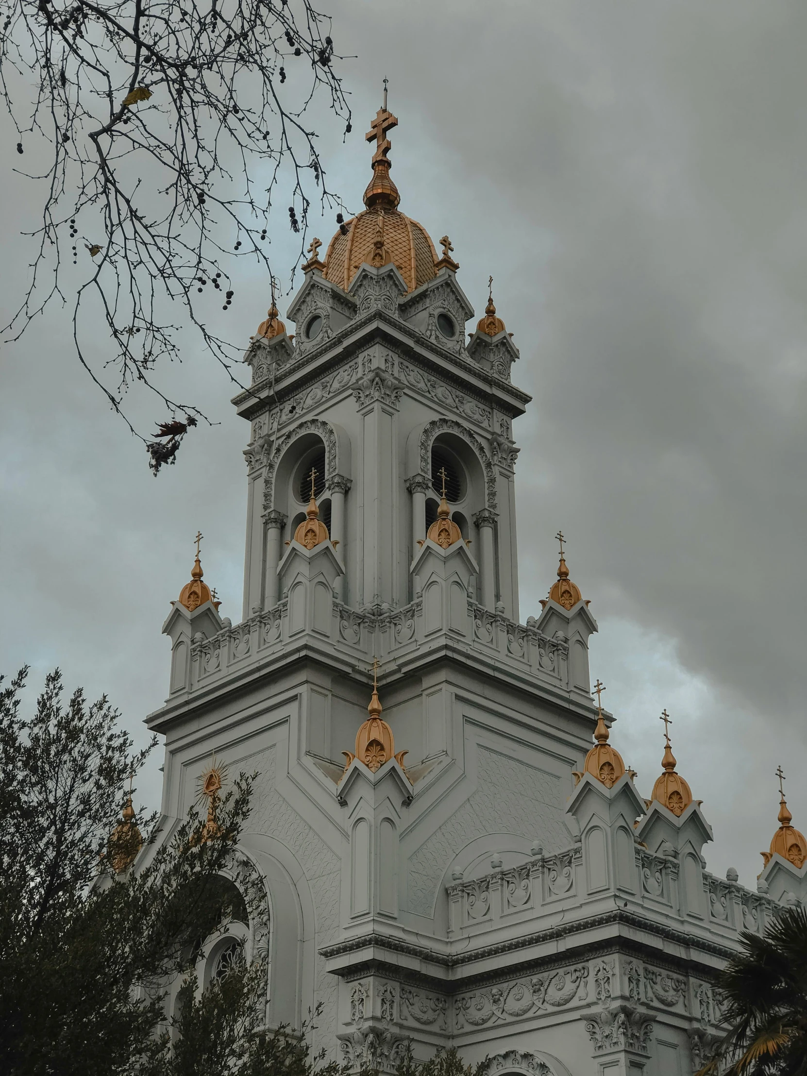 there is a tower of a building with golden bells