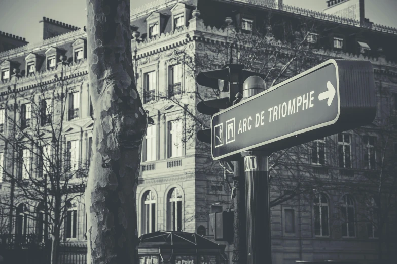 an old brick building is behind the sign for the street