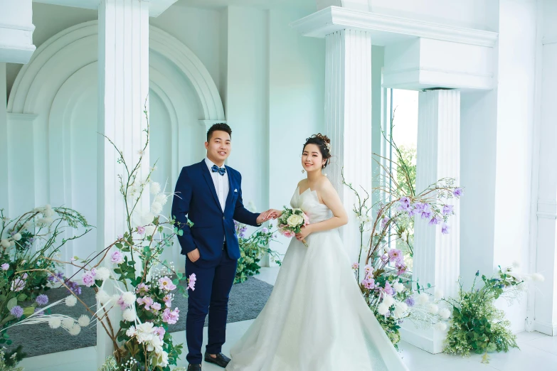 bride and groom in wedding dress posing for po