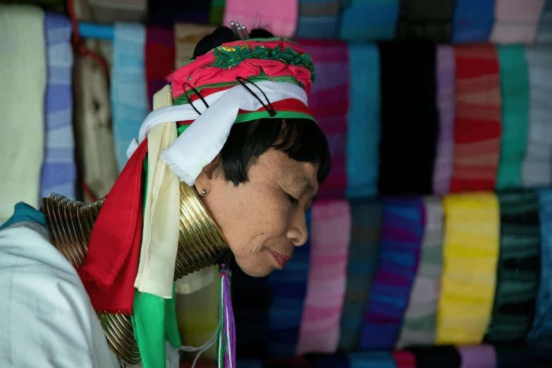 a woman wearing an elaborate hat and scarf