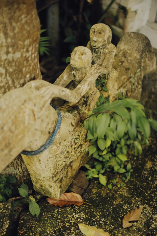 a stone statue made to look like two people