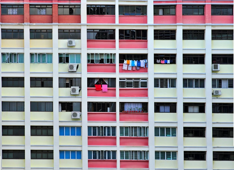 people on the windows in a large building