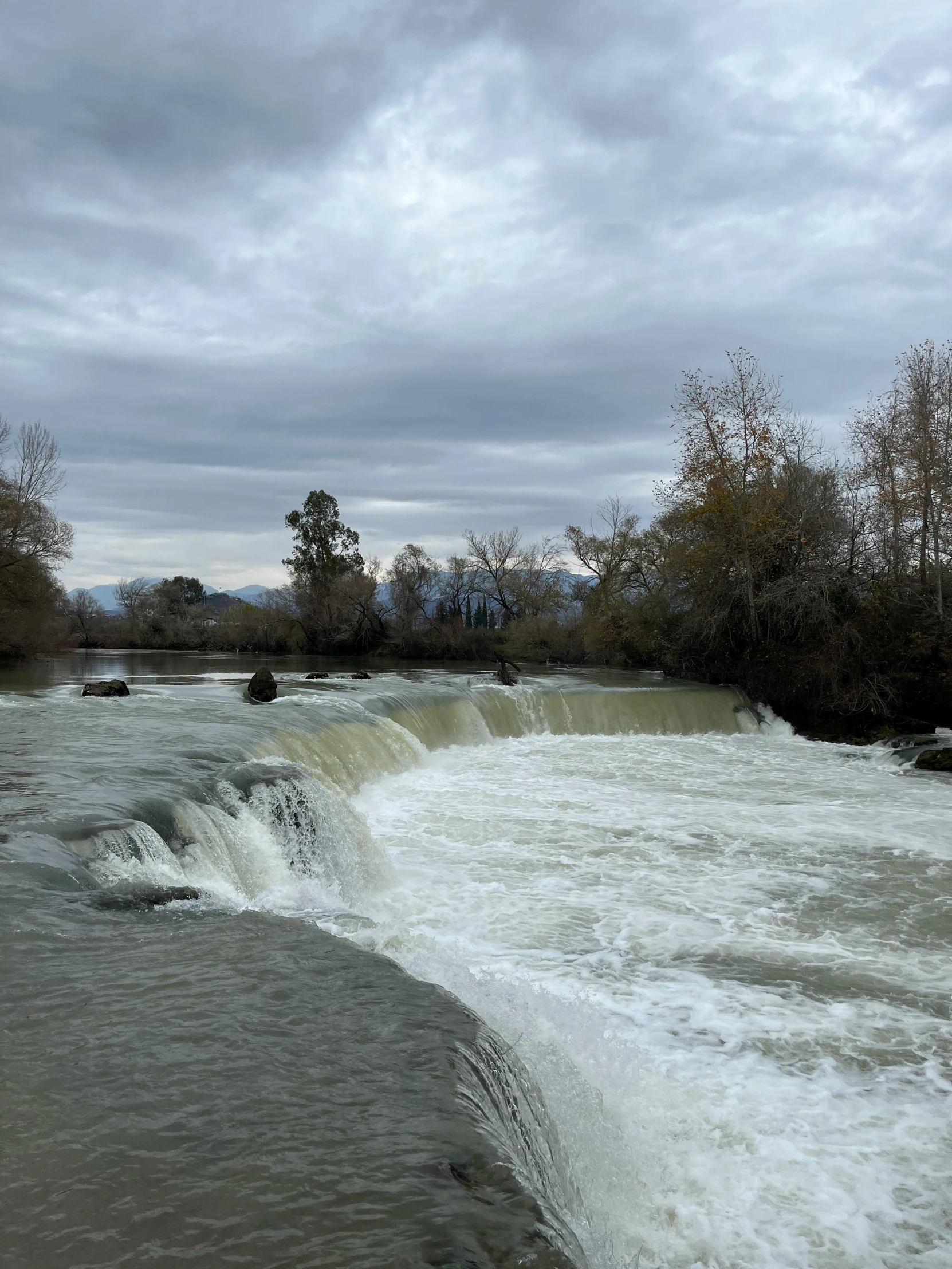 water flows near an artificial waterway and power plants