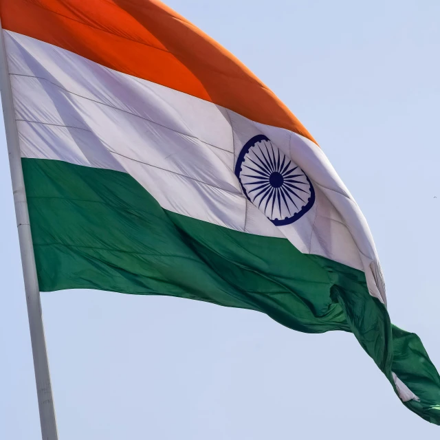an indian flag in the sky with white, green and orange colors