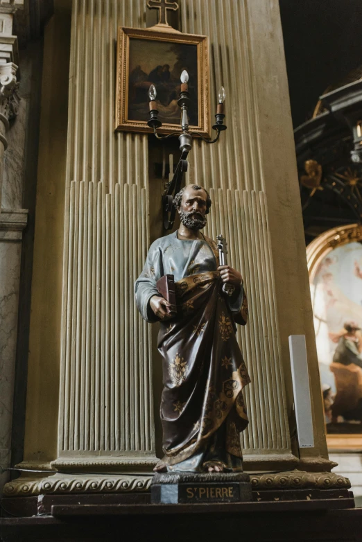 a statue in the center of a museum