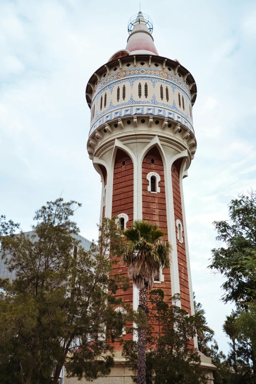 an architectural view of a round brick tower