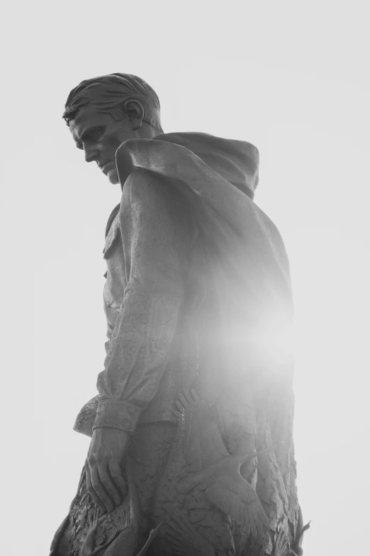 a black and white po of the back of a statue