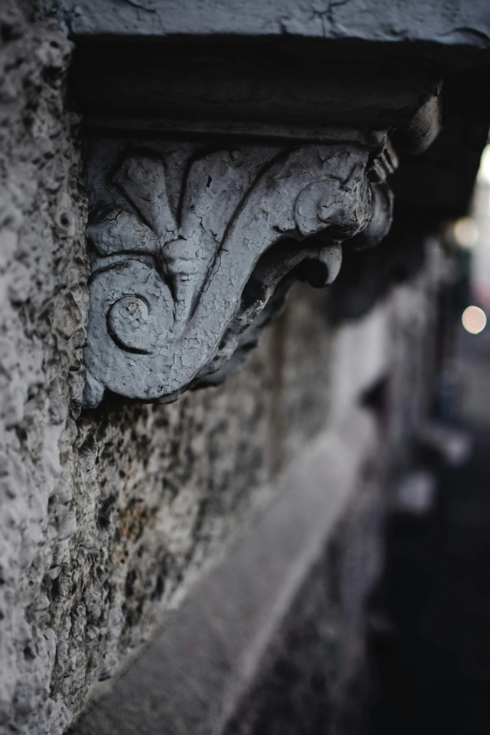 a stone shelf sits in the corner of a building