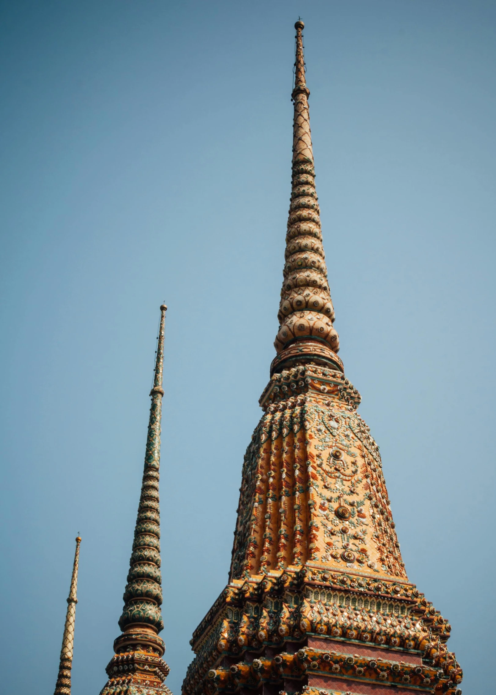 an elaborate building with ornate details and a steeple