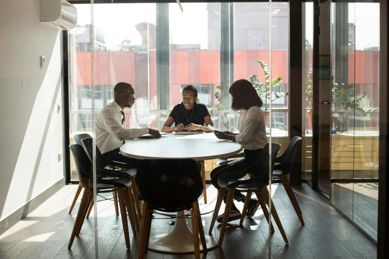 a group of people that are sitting around a table