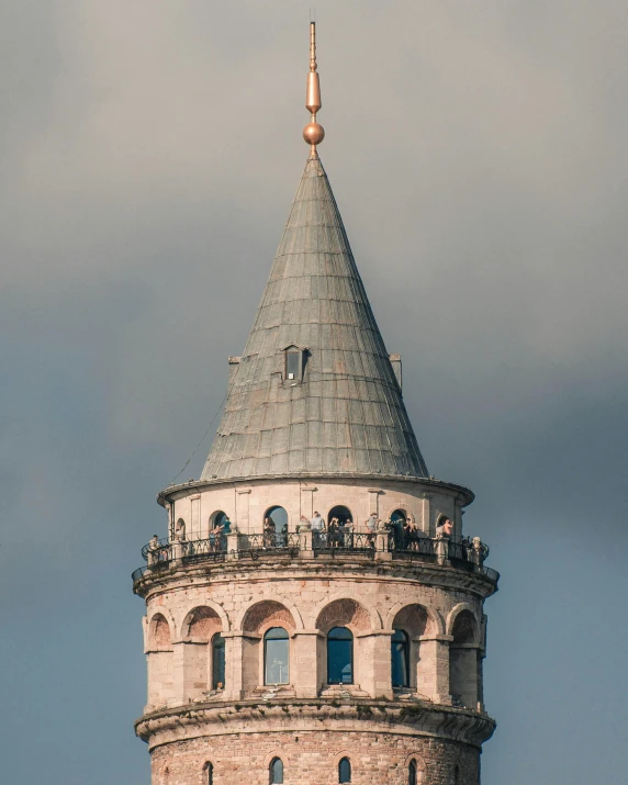 an old building has a tall tower with a pointed roof